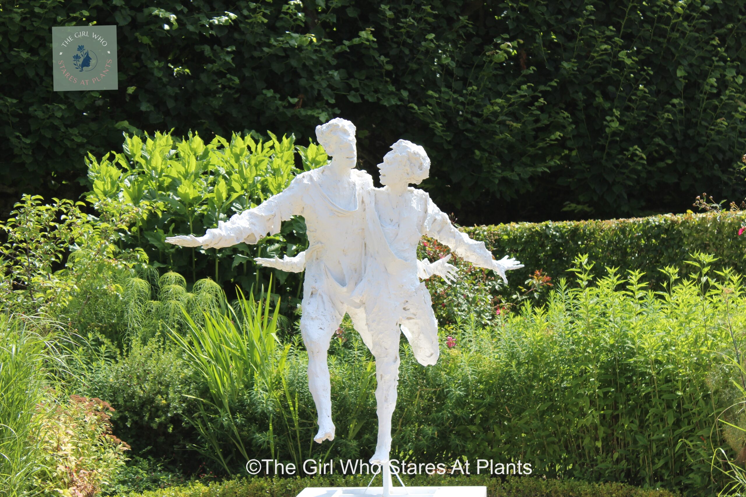 Sculpture of two people dancing in the garden