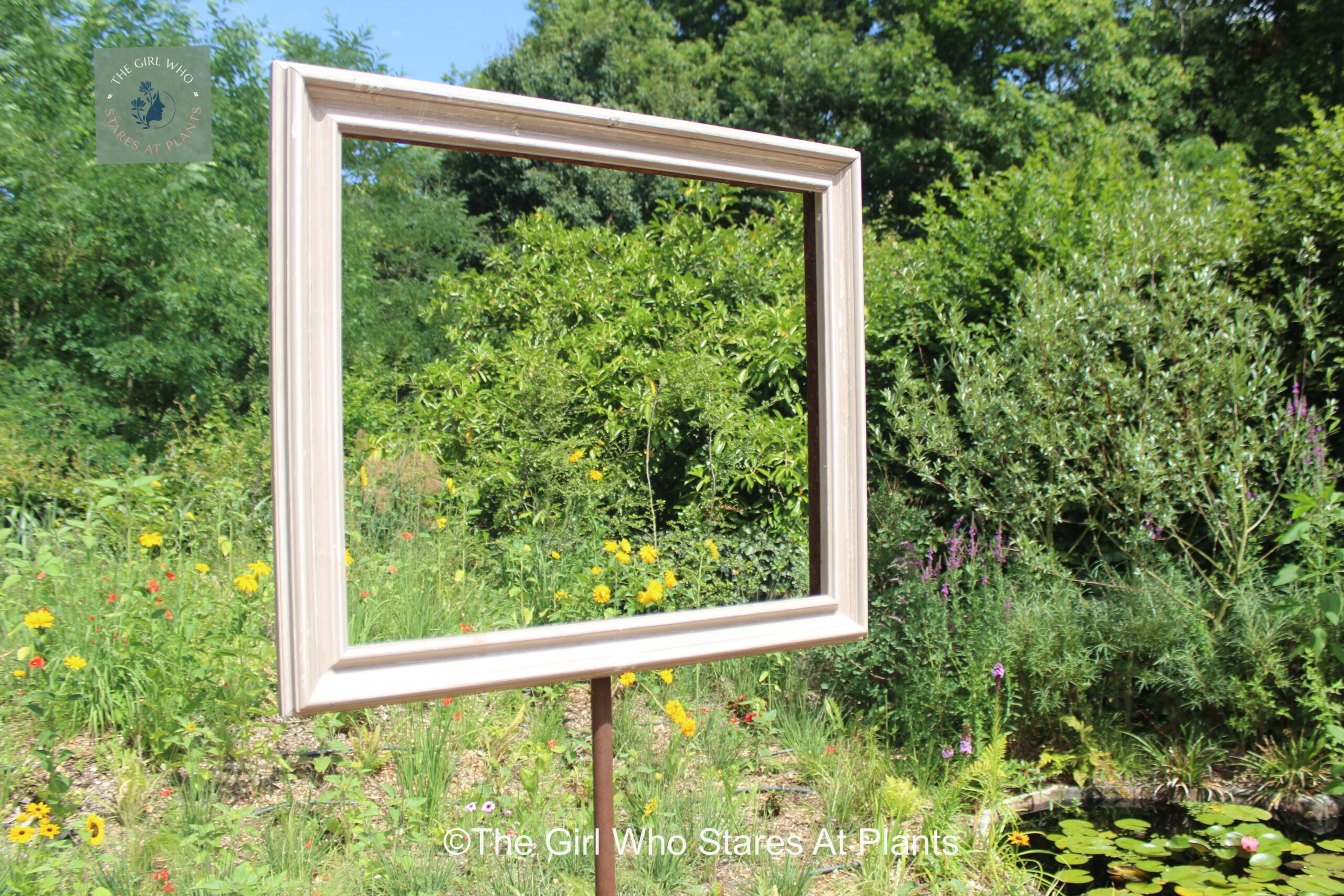 A picture frame in the garden. Garden design embellishments