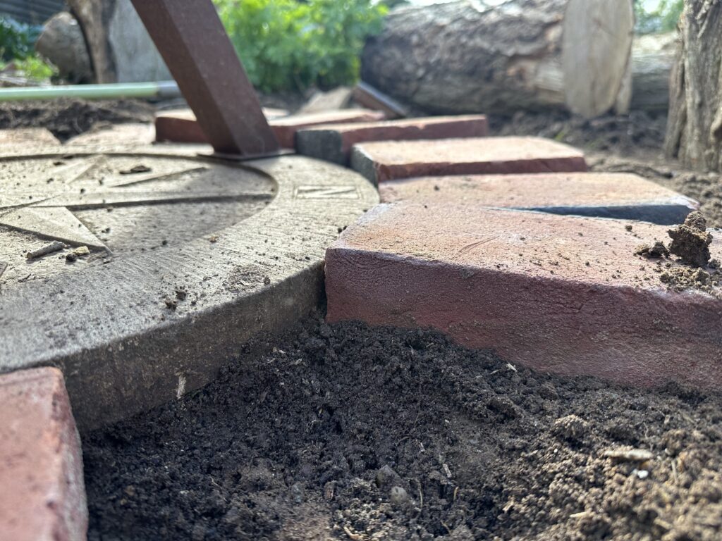 Bricks in a sunburst pattern as a firepit base