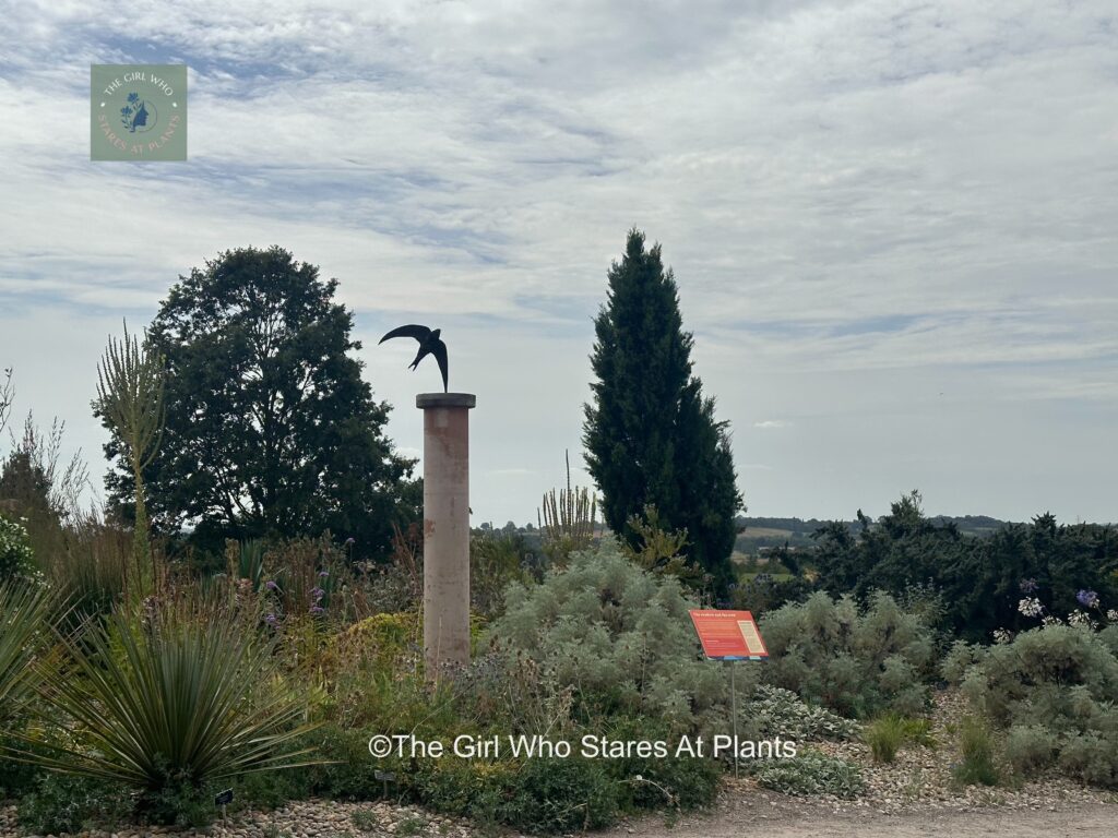 Bird sculpture in a garden at RHS Hyde Hall